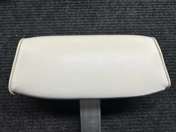 vertical scratch almost exactly in center of headrest back